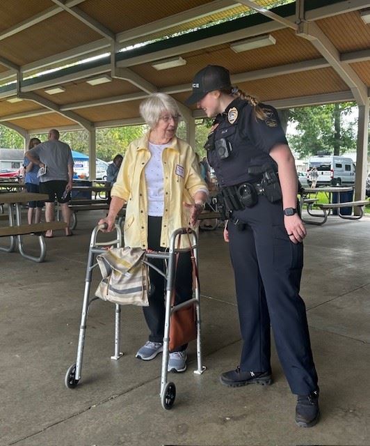 Female police officer talking to a female